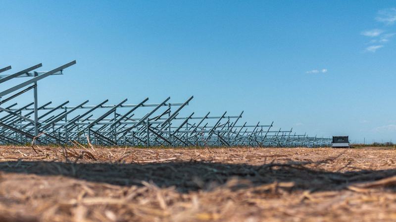 Installed solar mounting structures under a clear sky